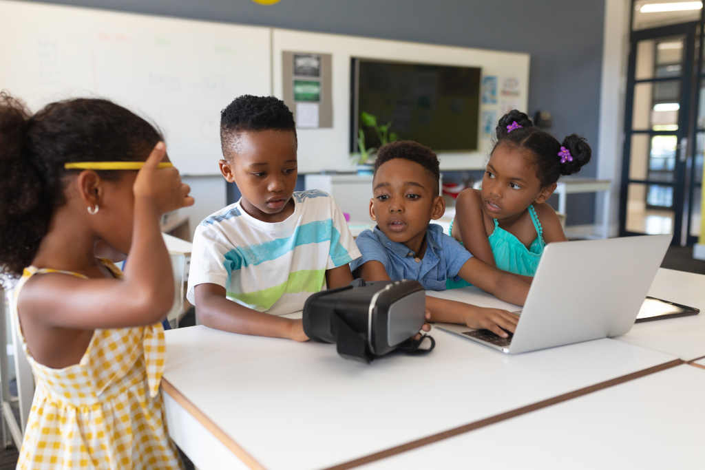 Kids exploring hands-on technology and AI together